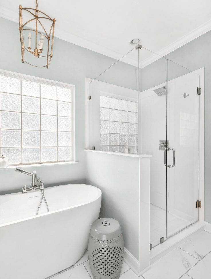 before-after-full-bathroom-gut-white-tub-blue-walls-chandelier-mt-juliet