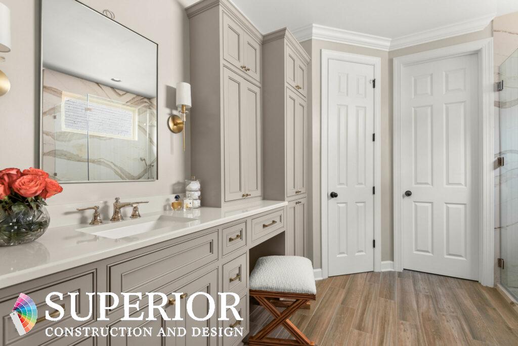 Nancy Meyers aesthetic neutral bathroom with classic, tailored accents in crystal, champagne gold and brushed gold